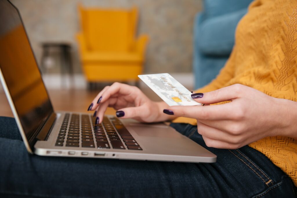 Close up of a woman buying online with bank card